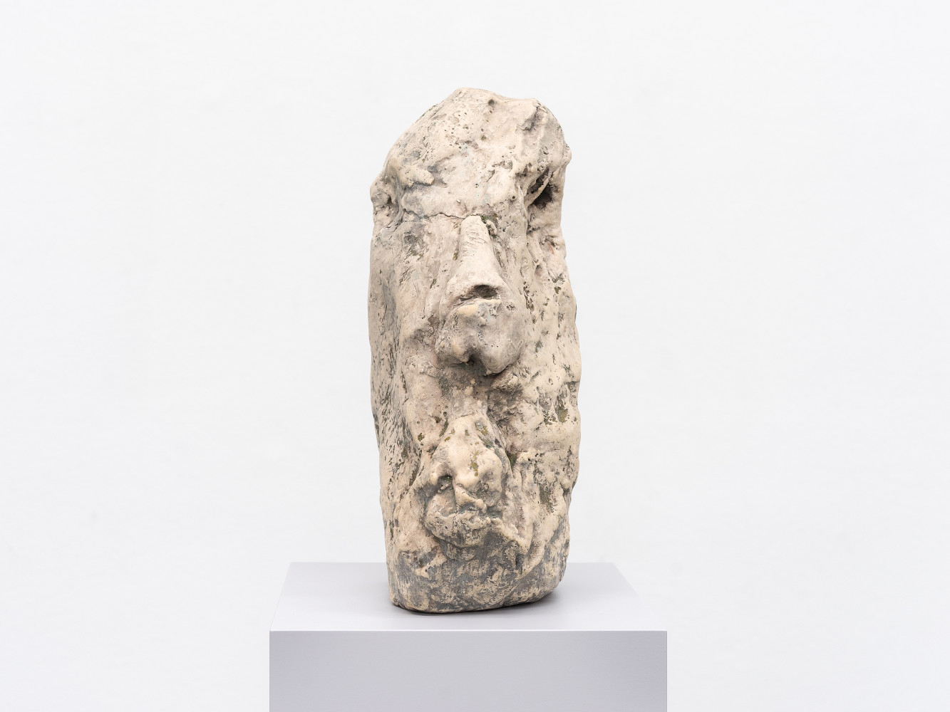 A sculpture by William Tucker depicting a face 